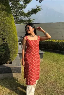 Sleeveless Red Printed Kurta with White Pants