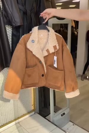 Cozy Shearling-Lined Suede Jacket on Display  Description: