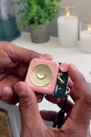 Cute Retro Pink Mini Bluetooth Speaker in Hand